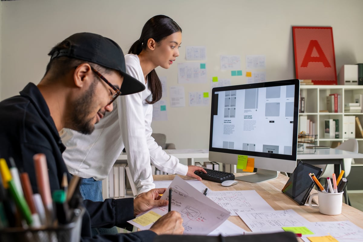 UX UI designers working on web design project